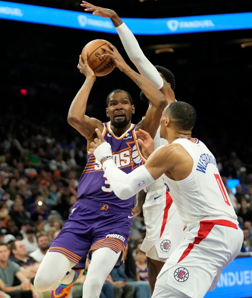 Phoenix Suns forward Kevin Durant (35) drives against LA Clippers guard Russell Westbrook (0) during the third quarter at Footprint Center in Phoenix on April 9, 2024.