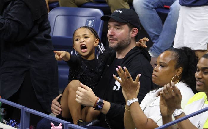 Olympia and Serena's husband in the stands