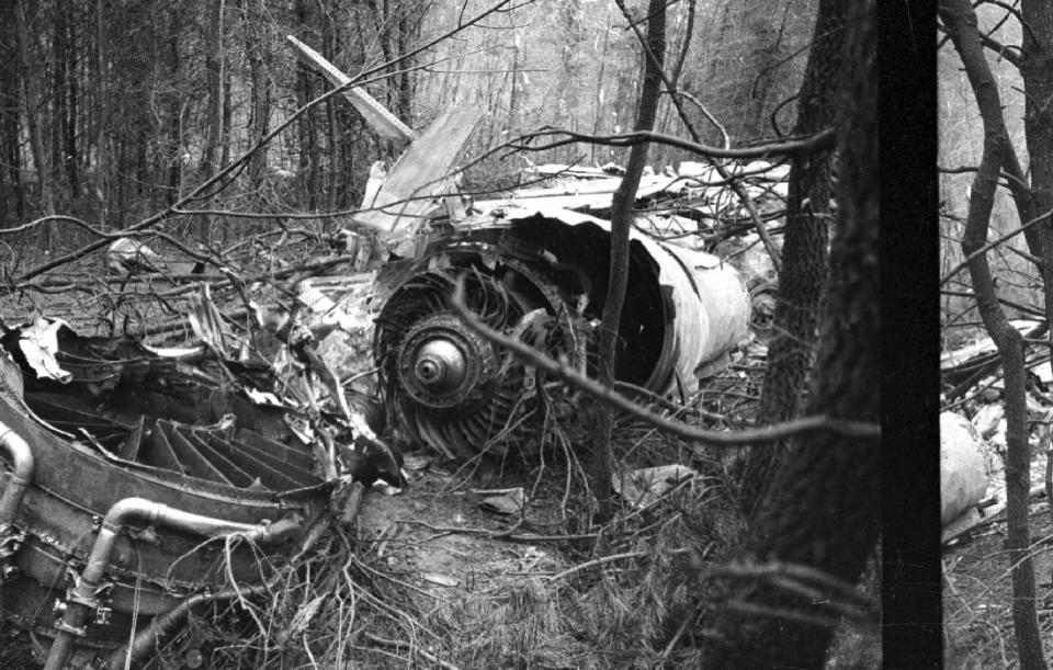 FILE - Parts of the engine lie on the ground after the Nov. 14, 1970, plane crash at Tri-State Airport in Huntington, W.Va., that killed 75 Marshall University football players, coaches, supporters and crew members. West Virginia could soon have a new holiday to memorialize 75 people killed in the Marshall University plane crash more than 50 years ago. Democratic Del. Sean Hornbuckle is the lead sponsor of the legislation, which passed the House Government Organization Committee on Monday, Jan. 16, 2023. (Jack Burnett/The Herald-Dispatch via AP)