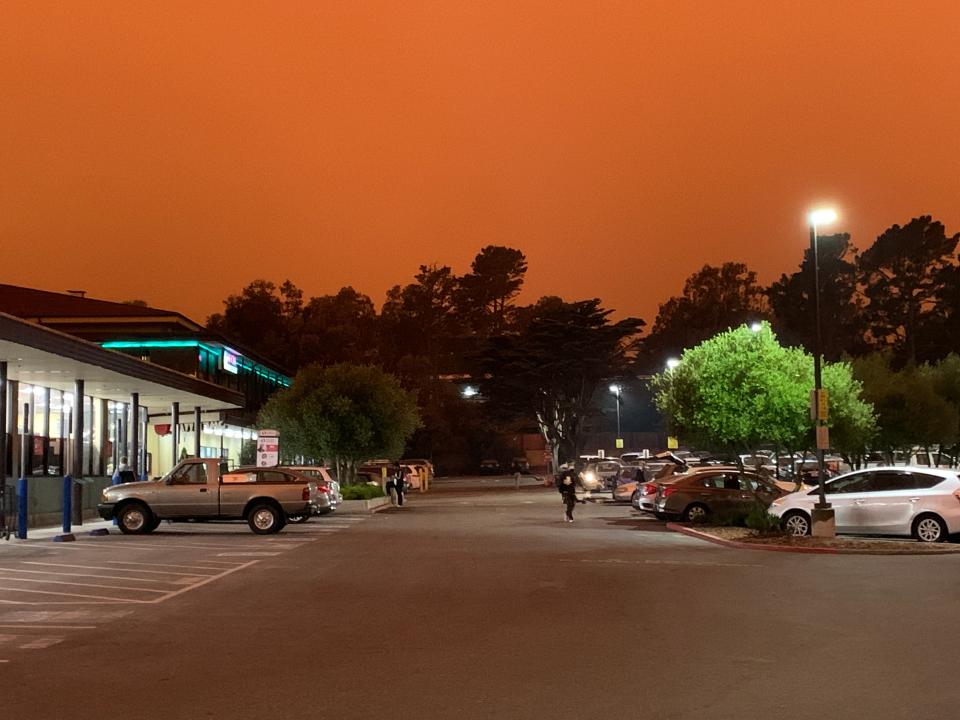 The parking lot of a Safeway supermarket in San Francisco's Diamond Heights neighborhood on Wednesday, September 9, 2020 at 11:15 am. The reddish-orange tinge to the sky is from multiple wildfires in the region.