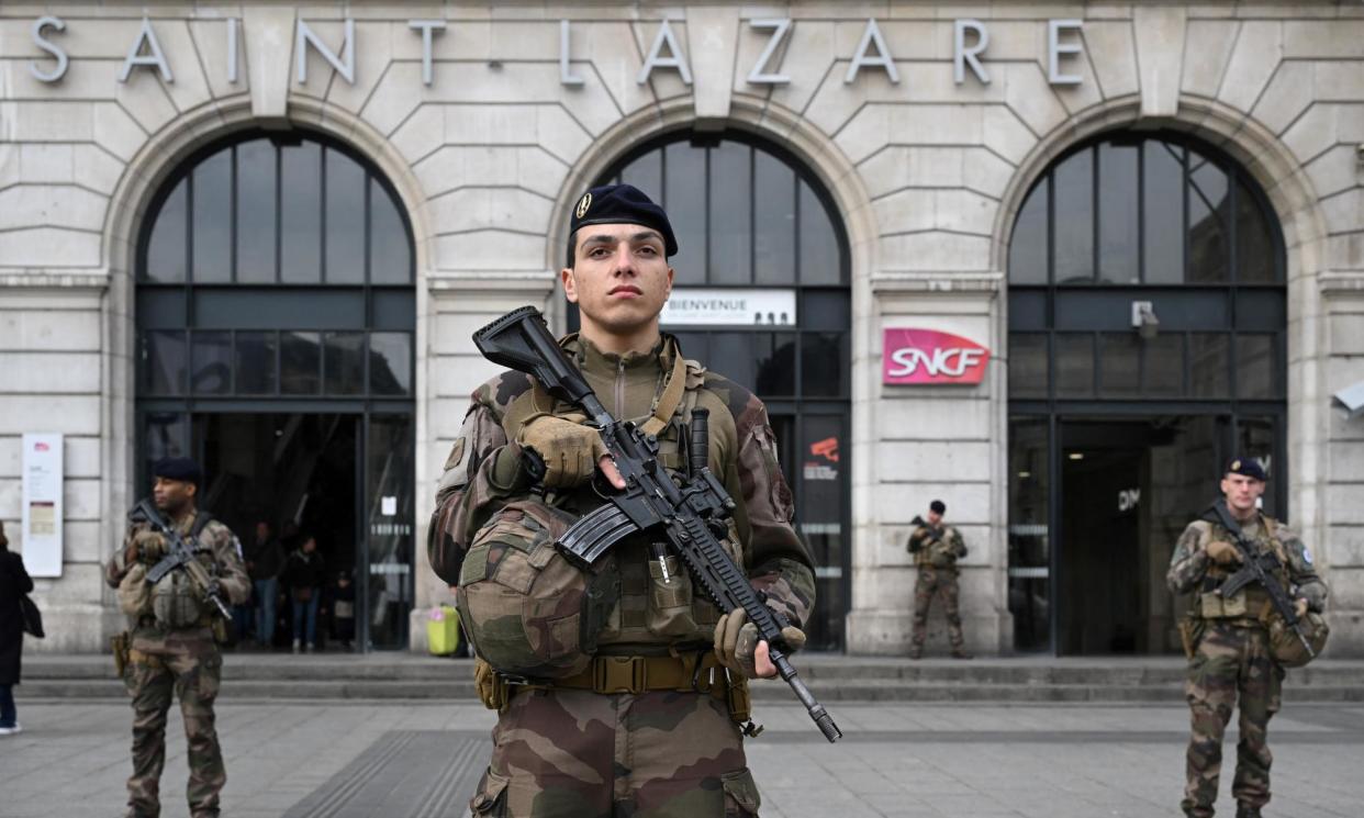 <span>French soldiers patrolling outside a railway station in Paris this week as security arrangements are put in place for the summer Olympics.</span><span>Photograph: Bertrand Guay/AFP/Getty Images</span>