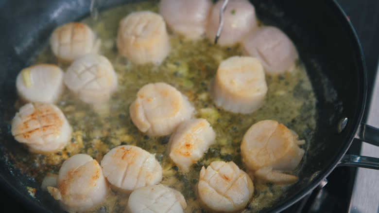 scallops cooking in pan