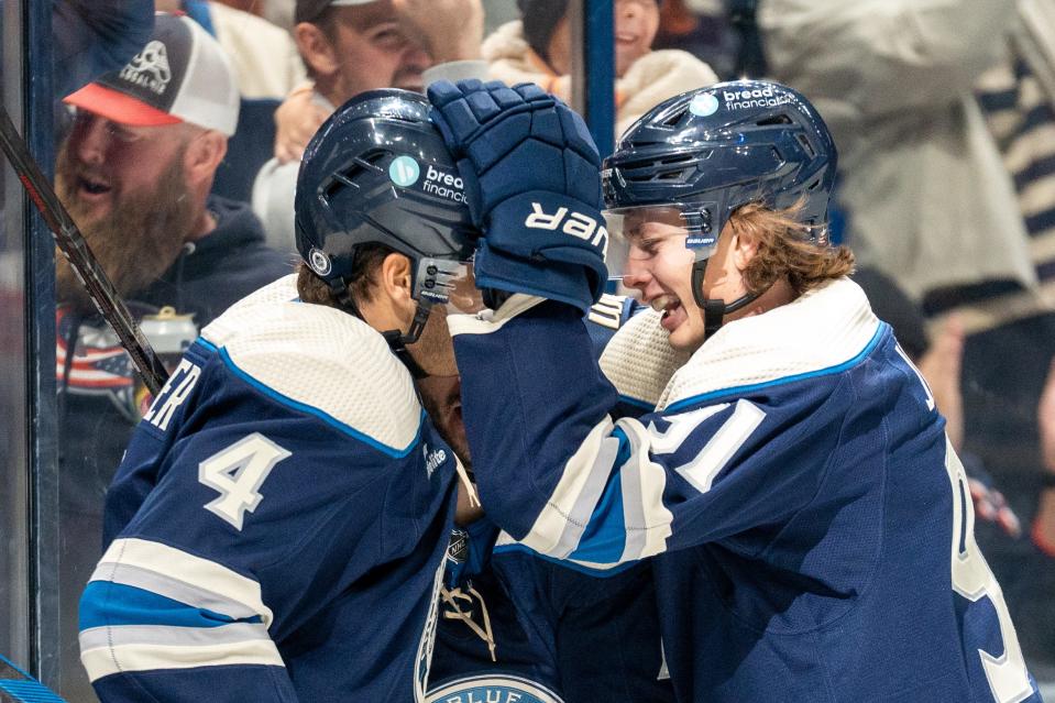 Oct 14, 2023; Columbus, Ohio, United States;
Columbus Blue Jackets right wing Justin Danforth (17) celebrates his goal with center Cole Sillinger (4) and Kent Johnson (91) during the third period their game against the New York Rangers on Saturday, Oct. 14, 2023 at Nationwide Arena.