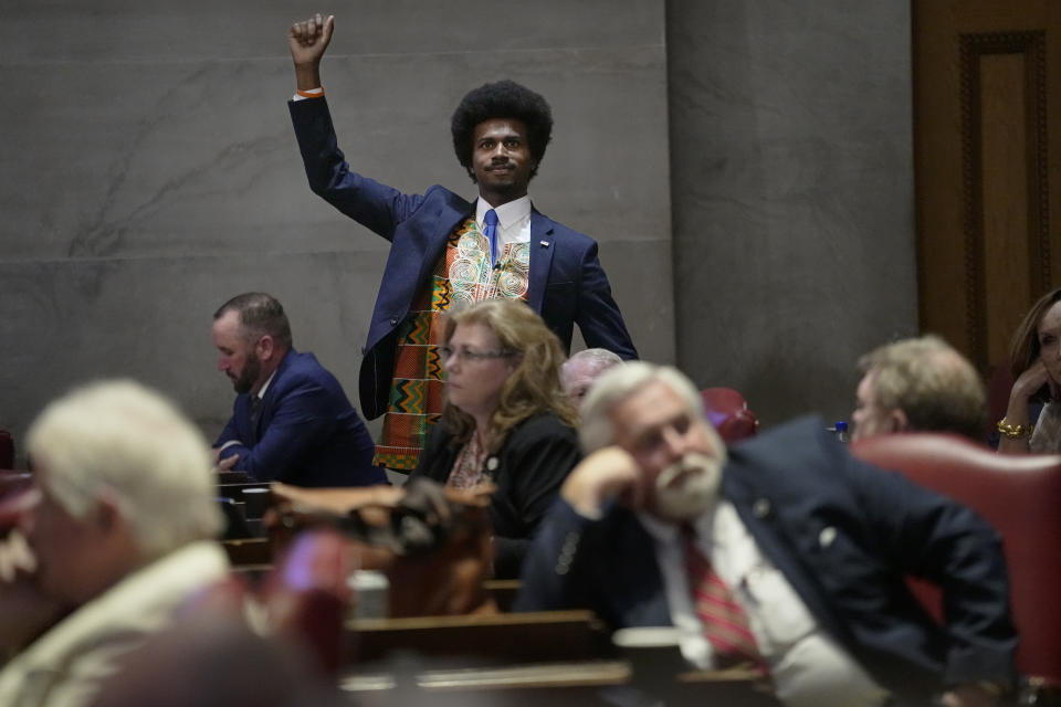 Rep. Justin J. Pearson, D-Memphis, raises his fist to acknowledge people in the gallery during a special session of the state legislature on public safety on Aug. 21, 2023, in Nashville, Tenn. (AP Photo/George Walker IV)