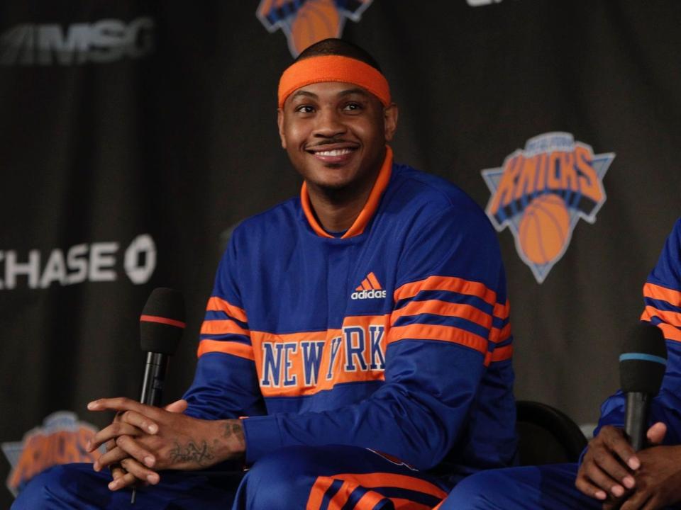 Carmelo Anthony smiles at his introductory press conference with the Knicks.