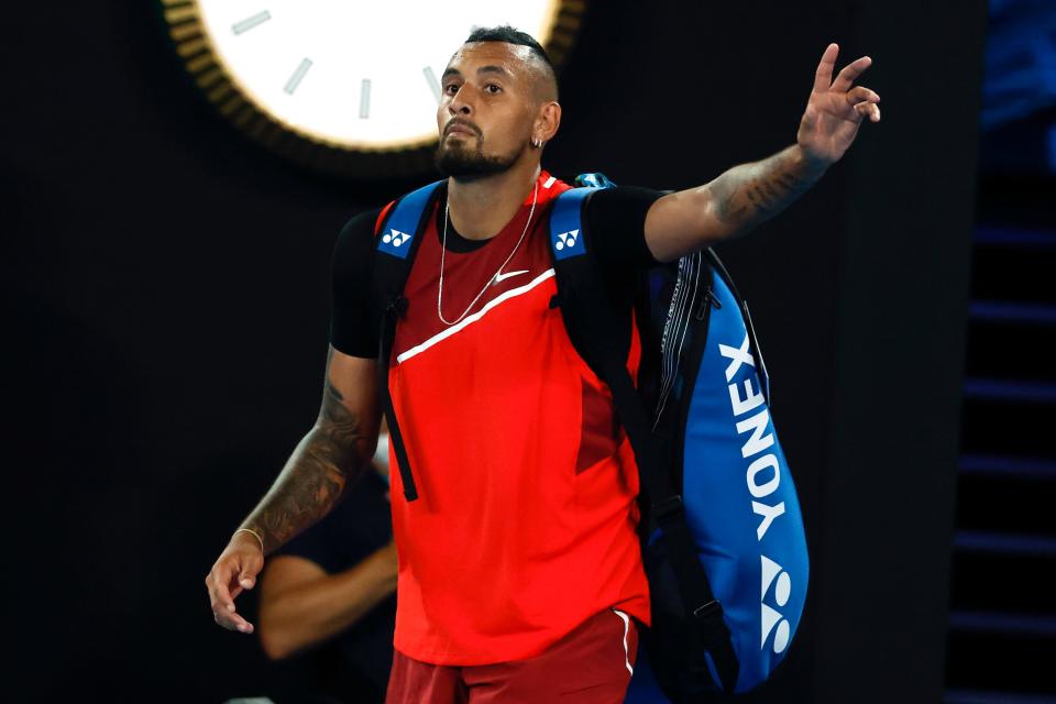 Nick Kyrgios of Australia gestures as he walks from Rod Laver Arena following his second round loss to Daniil Medvedev of Russia at the Australian Open tennis championships in Melbourne, Australia, Thursday, Jan. 20, 2022. (AP Photo/Hamish Blair)