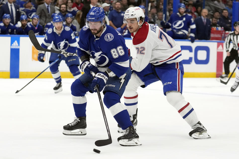 Tampa Bay Lightning right wing Nikita Kucherov (86) gets around Montreal Canadiens defenseman Arber Xhekaj (72) during the second period of an NHL hockey game Wednesday, Dec. 28, 2022, in Tampa, Fla. (AP Photo/Chris O'Meara)