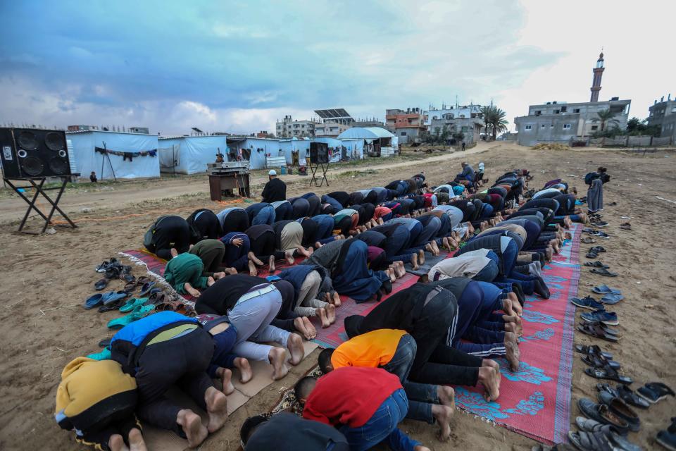 Displaced Palestinians offer Eid al-Fitr prayers in a Palestinian displaced persons camp on April 10, 2024 in Rafah, Gaza.