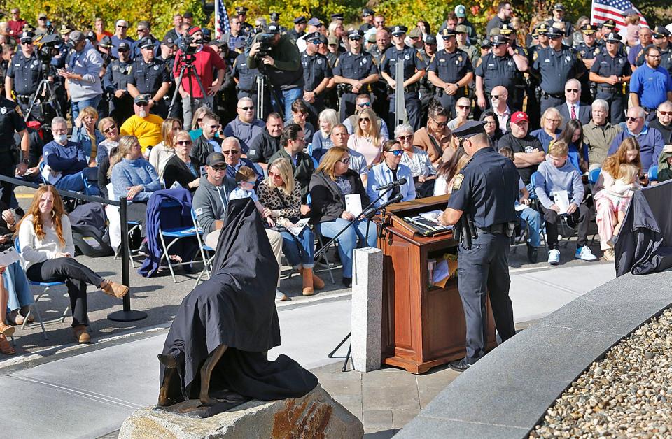 Braintree Police Chief Timothy Cohoon speaks about the dedication of his officers during a ceremony to dedicate a statue of K-9 Kitt and rededicate their police memorial at the Union Street station on Thursday, Oct. 19, 2023.