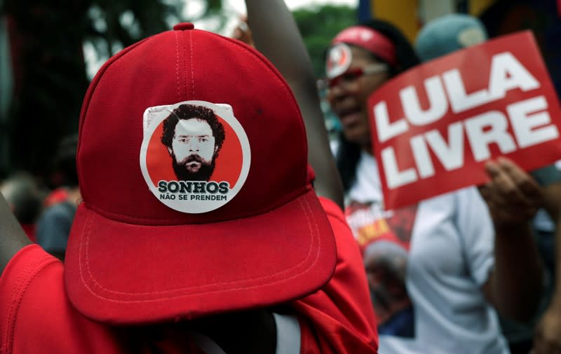 A person wears a cap with sticker reading "Dreams don't come true" as supporters of former Brazilian President Luiz Inacio Lula da Silva wait for his arrival after he was released from prison, in Sao Bernardo do Campo