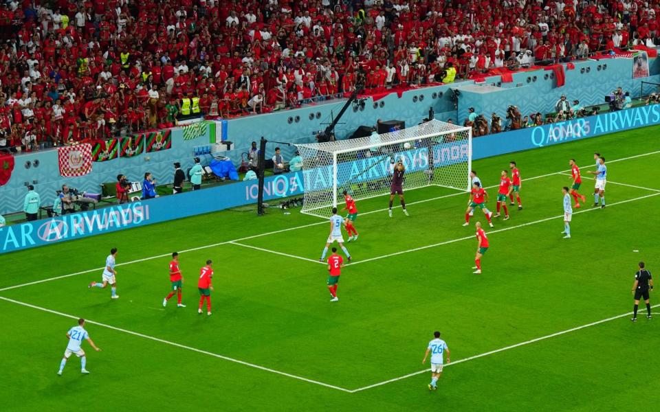 Goalkeeper Yassine Bounou of Morocco saves the shot of Dani Olmo of Spain far left. Morocco v Spain - SHUTTERSTOCK