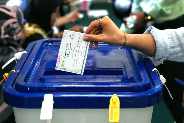 Around 61 million Iranians were eligible to cast ballots in the election necessitated by the death of ultraconservative president Ebrahim Raisi (RAHEB HOMAVANDI)