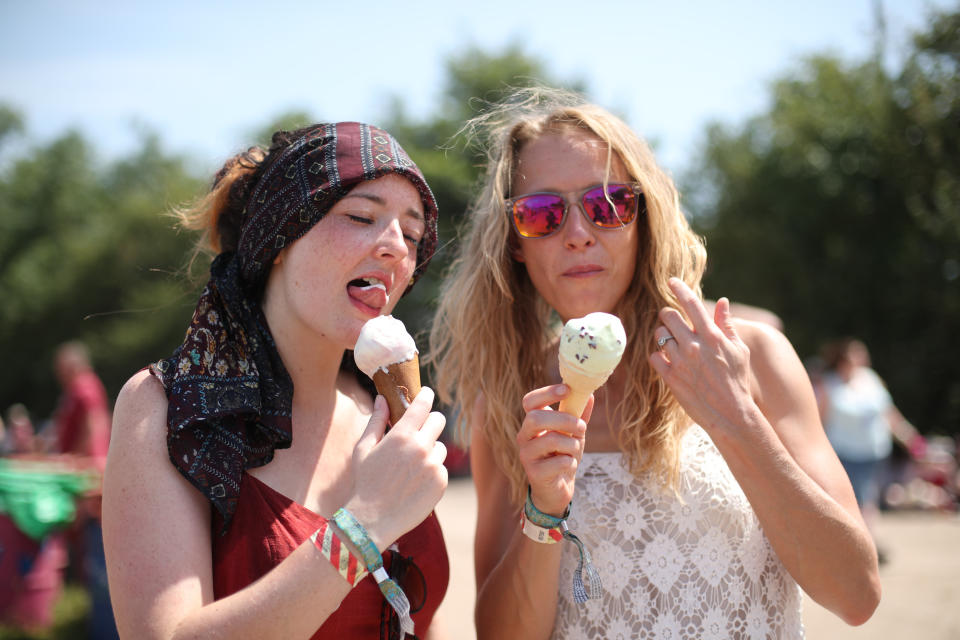 Festival goer enjoy ice cream in the hot weather at the Glastonbury Festival, at Worthy Farm in Pilton, Somerset.