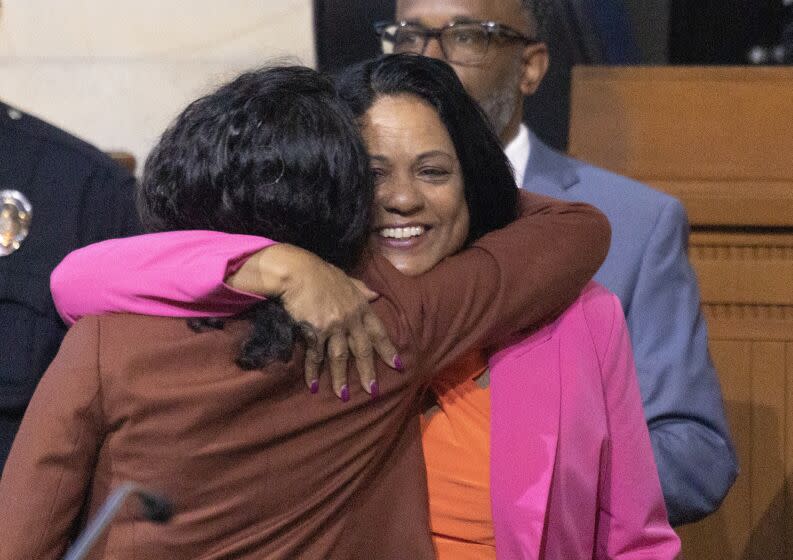 Los Angeles, CA - April 11: Heather Hutt, right, who was previously appointed caretaker of the 10th District, is congratulated by Nithya Raman Councilmember District 4, after being voted in to the Los Angeles City Council's 10th District seat to fill out the term of former Councilman Mark Ridley-Thomas, who was found guilty of federal corruption charges, at City Hall in Los Angeles Tuesday, April 11, 2023. (Allen J. Schaben / Los Angeles Times)