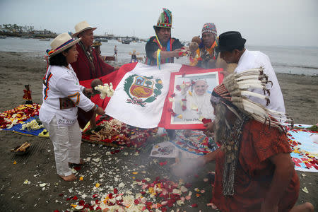 Peruvian shamans perform a ritual prior to the arrival of Pope Francis to Peru, at Pescadores beach in Chorrillos, Lima, Peru, January 17, 2018. REUTERS/Guadalupe Pardo