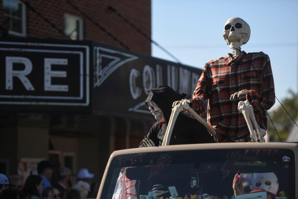 Skeletons ride in the parade at the 34th annual Oliver Hardy Festival in Harlem, Ga., on Saturday, Oct. 7, 2023. People turned out to honor the famous actor with a parade, music, and more.