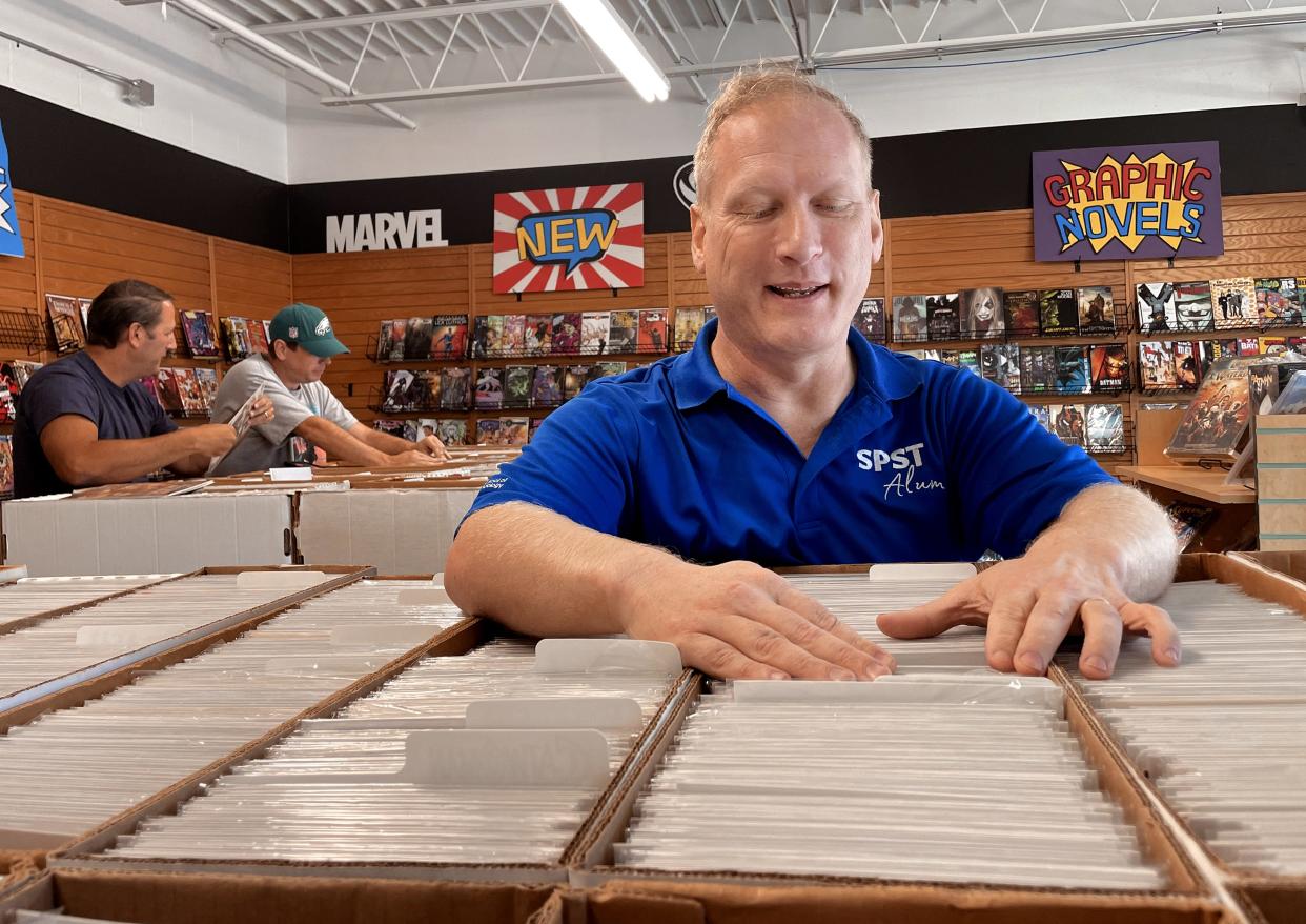 Nash Carey looks through comic books for sale at Sanctuary Comics & Games, 4 E Ayers, No. 150 in Edmond.