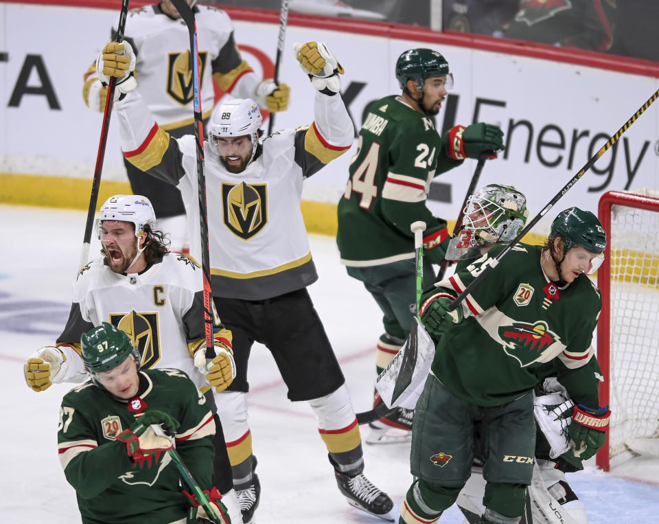 Vegas Golden Knights right wing Mark Stone (61) celebrates after scoring against the Minnesota Wild during the second period in Game 3 of an NHL hockey Stanley Cup first-round playoff series Thursday, May 20, 2021, in St. Paul, Minn. (Aaron Lavinsky/Star Tribune via AP)