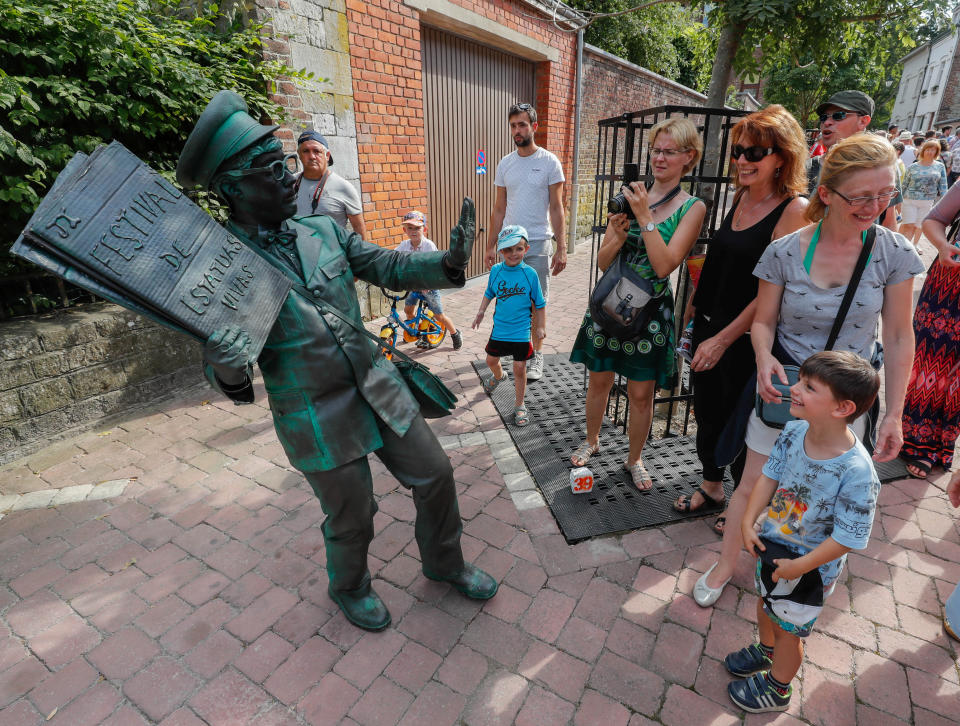 <p>An artist called “Le Facteur/The Postman” takes part in the festival “Statues en Marche” in Marche-en-Famenne, Belgium, July 22, 2018.(Photo: Yves Herman/Reuters) </p>