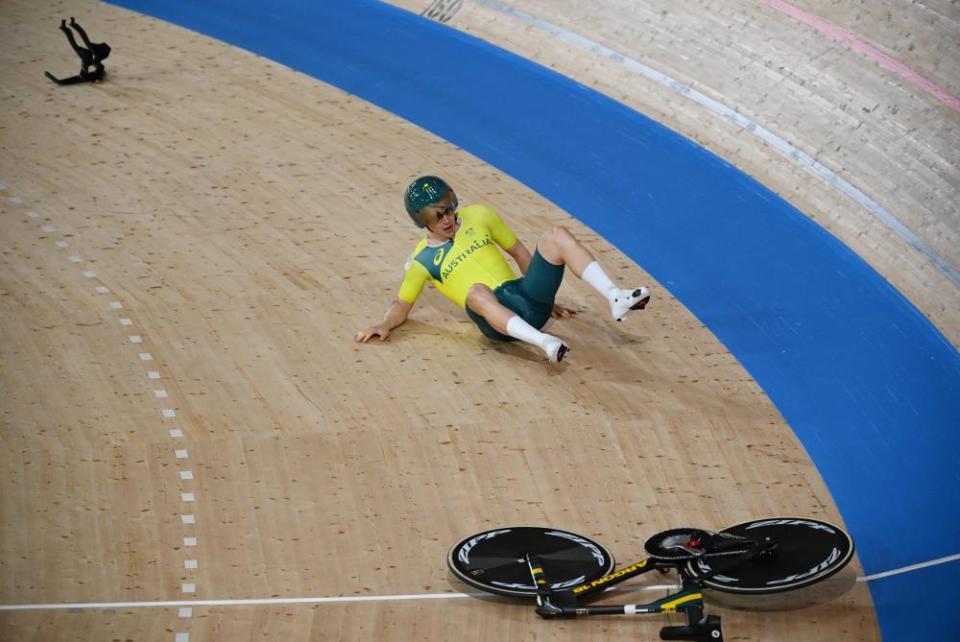 Australia’s Alexander Porter spills on to the track.