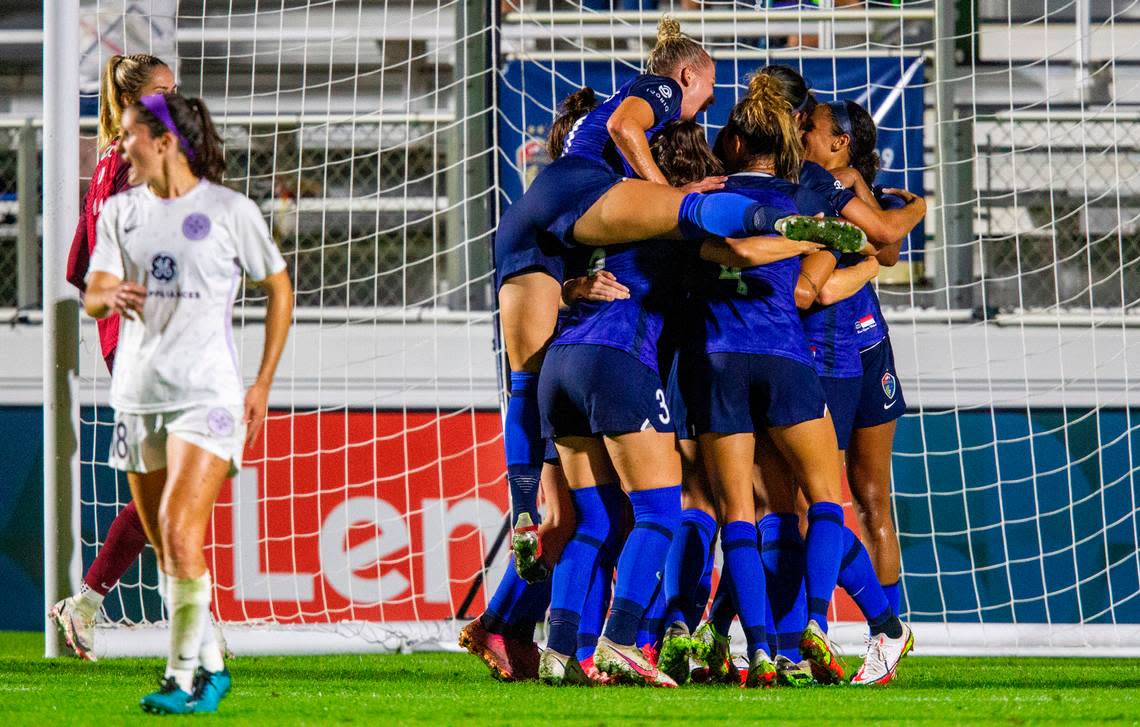 North Carolina Courage players celebrate a first half goal against Racing Louisville Wednesday, Oct. 6, 2021 at WakeMed Soccer Park in Cary. The NC Courage won 3-1.