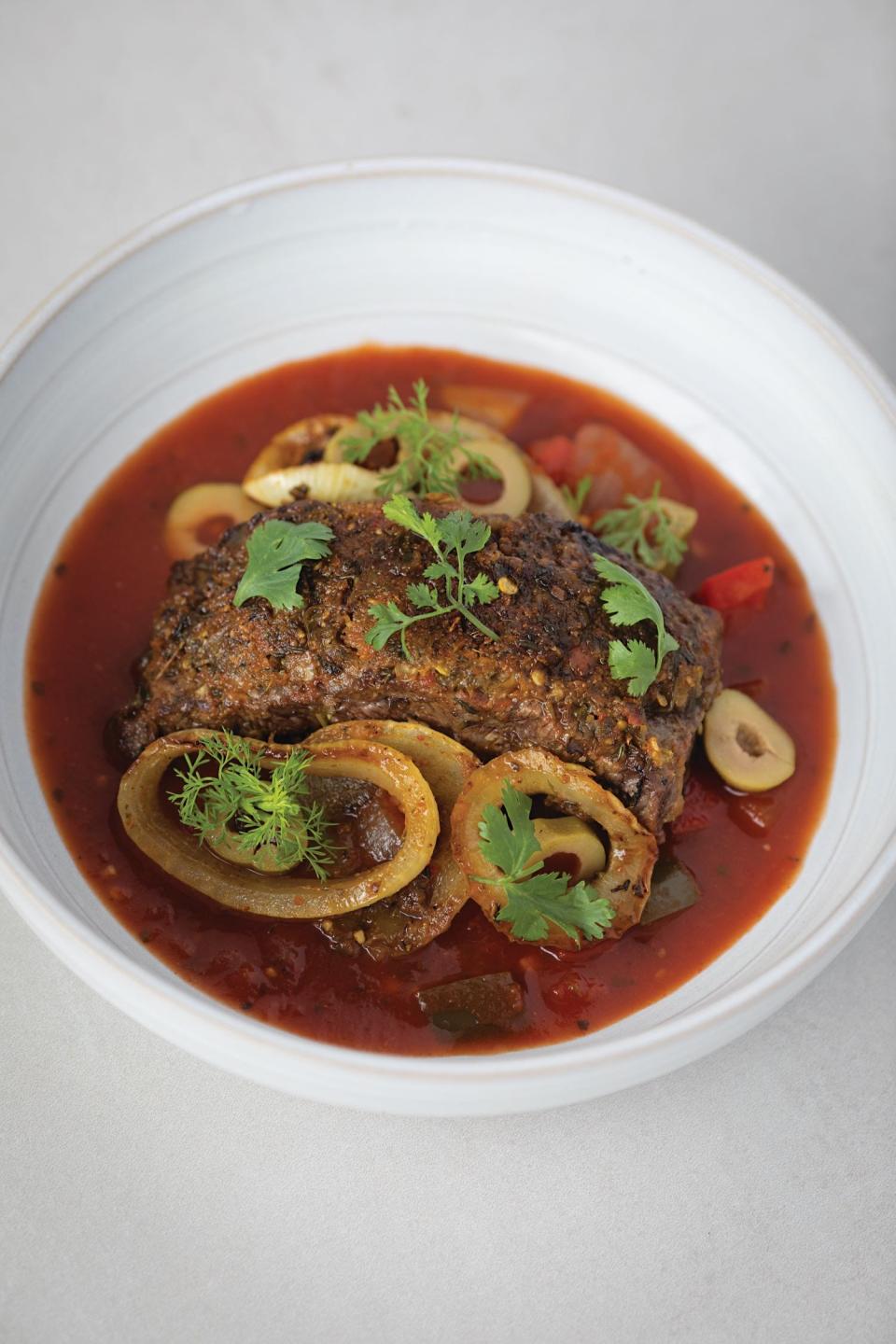 Bistec Encebollado from "Roots, Heart, Soul: The Story, Celebration, and Recipes of Afro Cuisine in America" by Todd Richards with Amy Paige Condon for Harvest an Imprint of Harper Collins