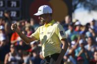 Webb Simpson celebrates making a birdie on the 18th green forcing a playoff during the final round of the Waste Management Phoenix Open PGA Tour golf event Sunday, Feb. 2, 2020, in Scottsdale, Ariz. (AP Photo/Ross D. Franklin)