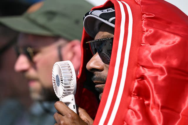 <p>KIRILL KUDRYAVTSEV/AFP via Getty</p> Snoop Dogg at the 2024 Summer Olympics in Paris