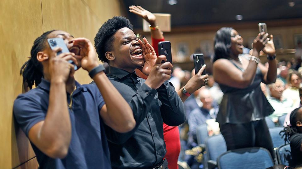 Siblings of graduate Naellah Lerick cheer her after she received her diploma during Archbishop Williams High School's graduation on Thursday, May 23, 2024.