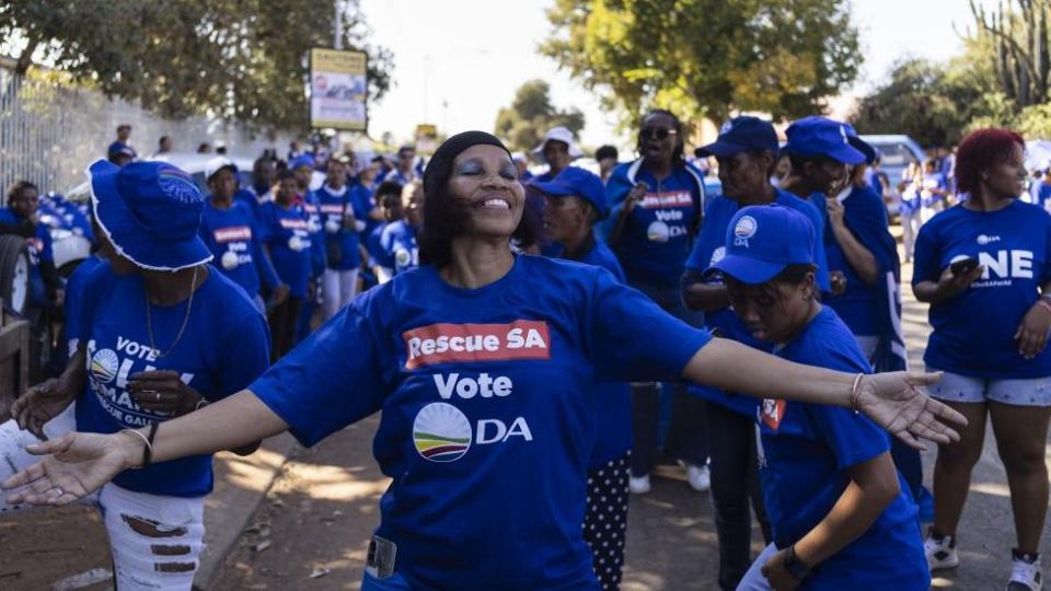 Supporters of the Democratic Alliance (DA) join a party election rally and inspection of the local community in Eldorado Park and Ennerdale, in Johannesburg, South Africa, 01 May 2024