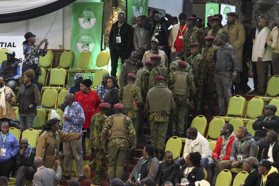 Police are deployed to provide security after scuffles broke out between political party agents and police at the electoral commission's national tallying center in Nairobi, Kenya late night Saturday, Aug. 13, 2022. Kenya's peaceful presidential election saw a brief disruption late Saturday when police responded to scuffles at the national tallying center amid tensions over the close results. (AP Photo)