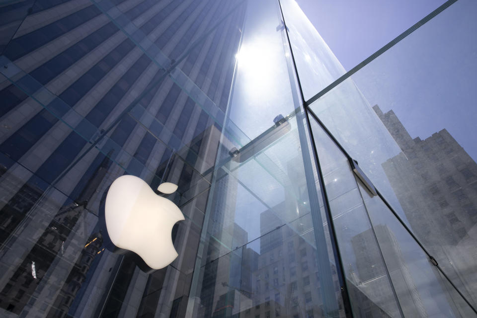 FILE - In this Tuesday, June 16, 2020 file photo, the sun is reflected on Apple's Fifth Avenue store in New York. In the years since Barack Obama and Joe Biden left the White House, the tech industry's political fortunes have flipped. Facebook, Google, Amazon and Apple have come under scrutiny from Congress, federal regulators, state attorneys general and European authorities. (AP Photo/Mark Lennihan, File)