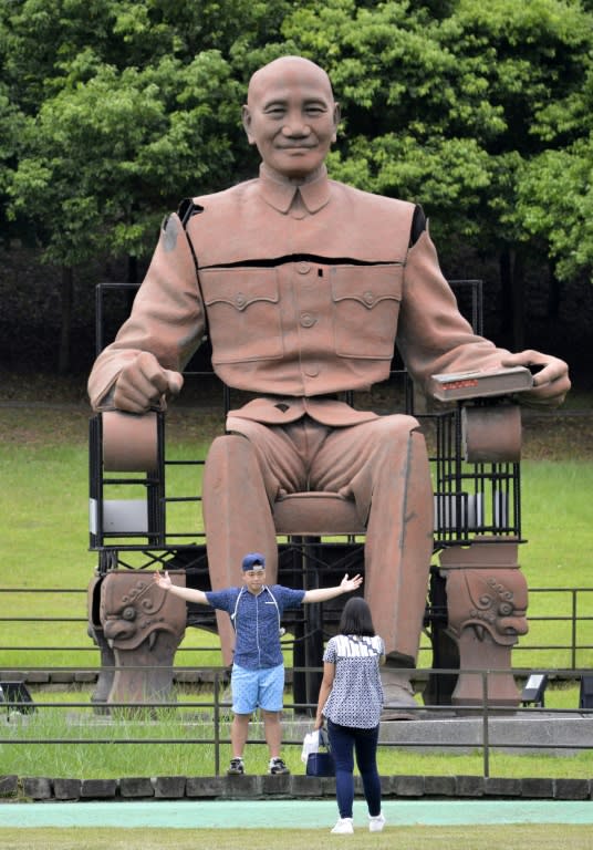 The largest memorial is an imposing statue of a seated Chiang, removed from a government office in the southern city of Kaohsiung in 2007