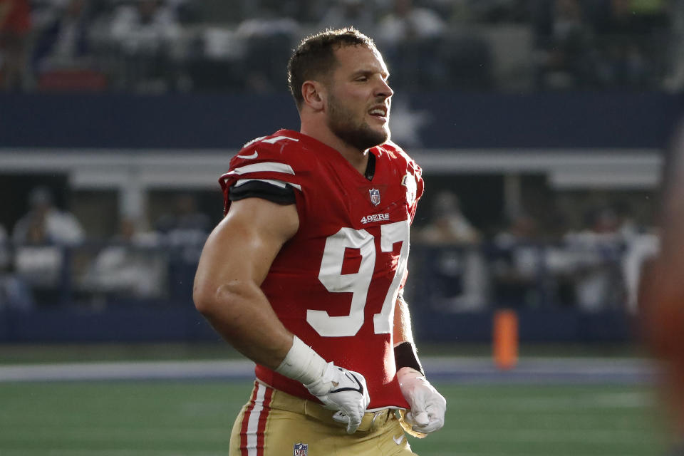 San Francisco 49ers defensive end Nick Bosa walks off the field during the first half of an NFL wild-card playoff football game against the Dallas Cowboys in Arlington, Texas, Sunday, Jan. 16, 2022. (AP Photo/Roger Steinman)