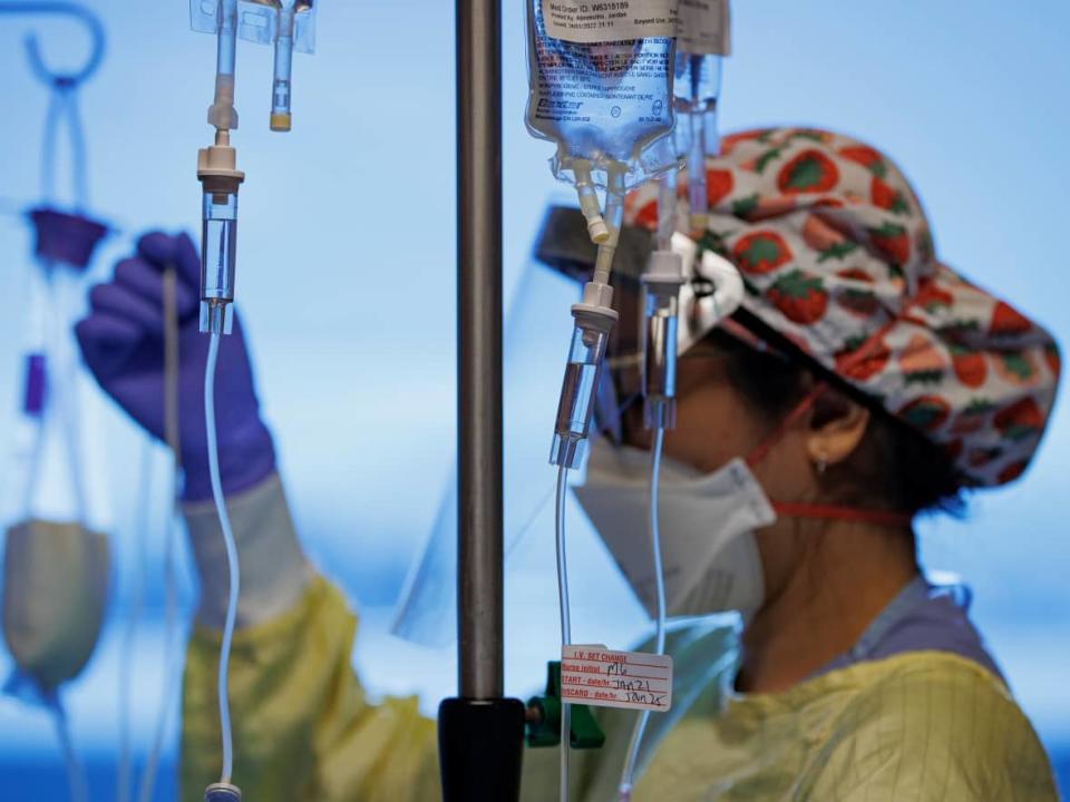 A nurse attends to a COVID-19 patient on a ventilator in the intensive care unit of Humber River Hospital, in Toronto, in January. One expert says it was entirely predictable that Saskatchewan would record more COVID-19 deaths in 2022 than the same period of 2021.  (Evan Mitsui/CBC - image credit)