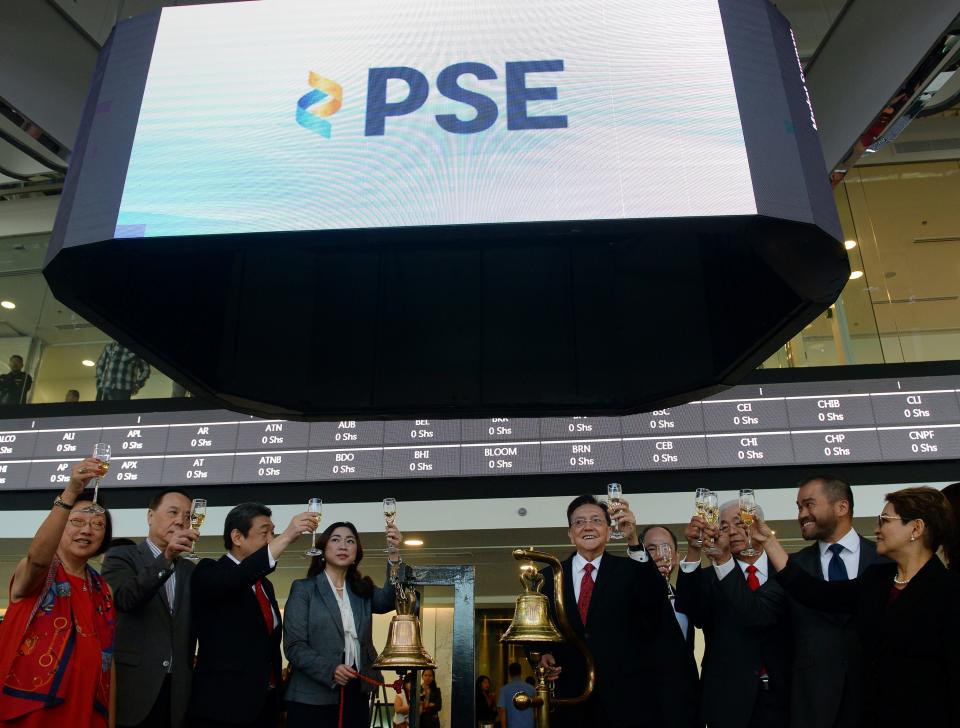 Officials to mark the opening of the Philippine Stock Exchange’s new building in Taguig City. (Photo: Getty Images)