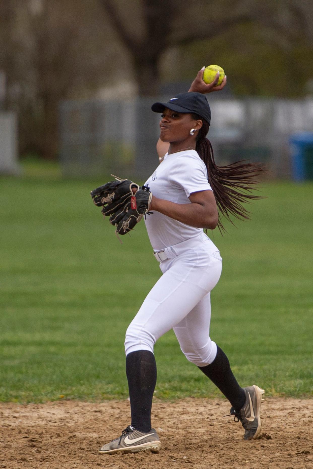Framingham High junior Kayla Goodridge throws the ball towards home plate during varsity softball practice at Framingham High School, April 30, 2024.