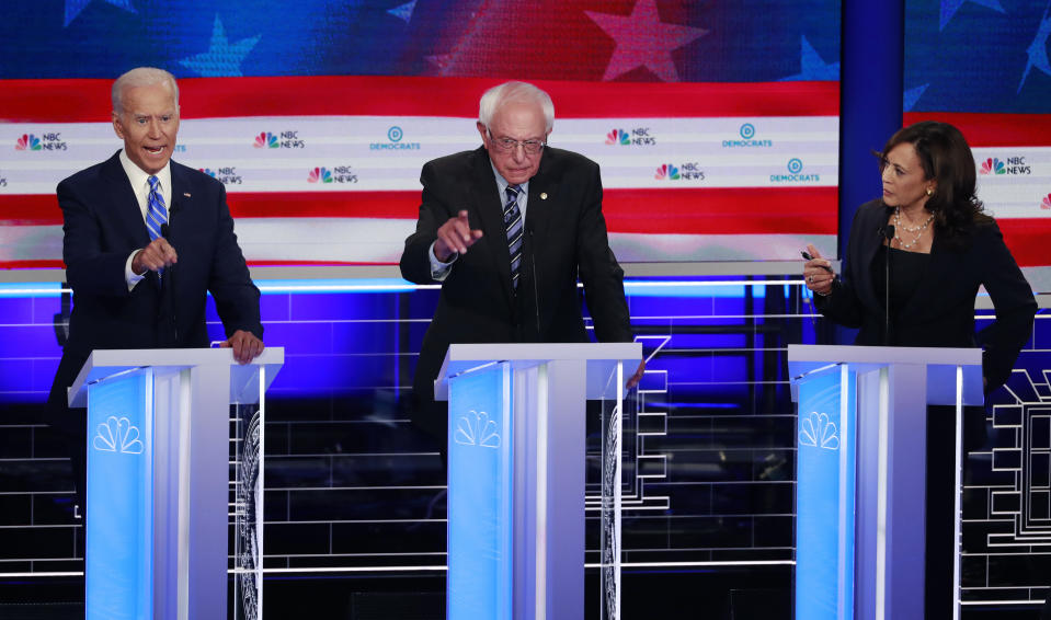 Democratic presidential candidate former vice president Joe Biden, left, Sen. Bernie Sanders, I-Vt., and Sen. Kamala Harris, D-Calif., all talk at the same time during the Democratic primary debate hosted by NBC News at the Adrienne Arsht Center for the Performing Arts, Thursday, June 27, 2019, in Miami. (AP Photo/Wilfredo Lee)