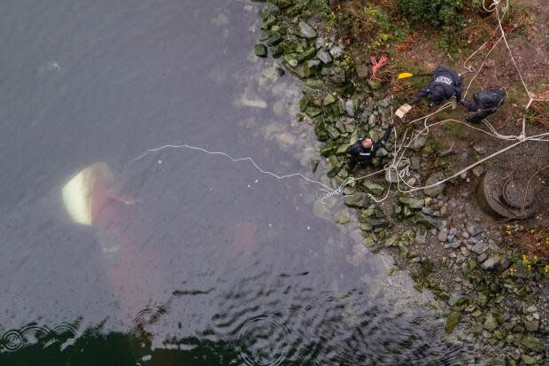 VPD Marine Unit officers investigate the scene of a sunken boat in False Creek near the Cambie Bridge in Vancouver in December. 