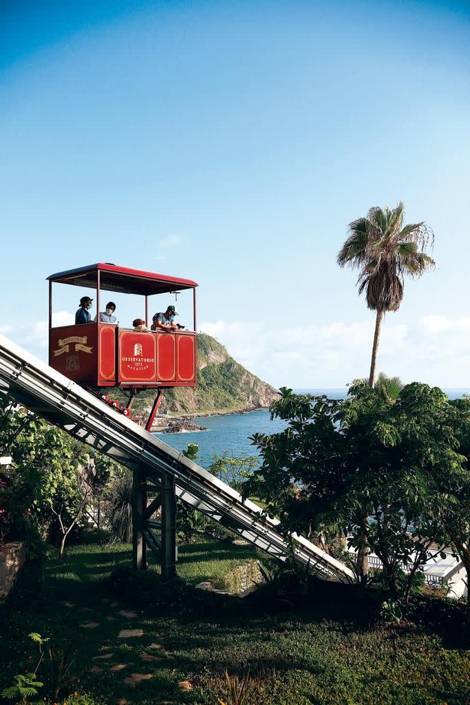 a group of people ride a roller coaster