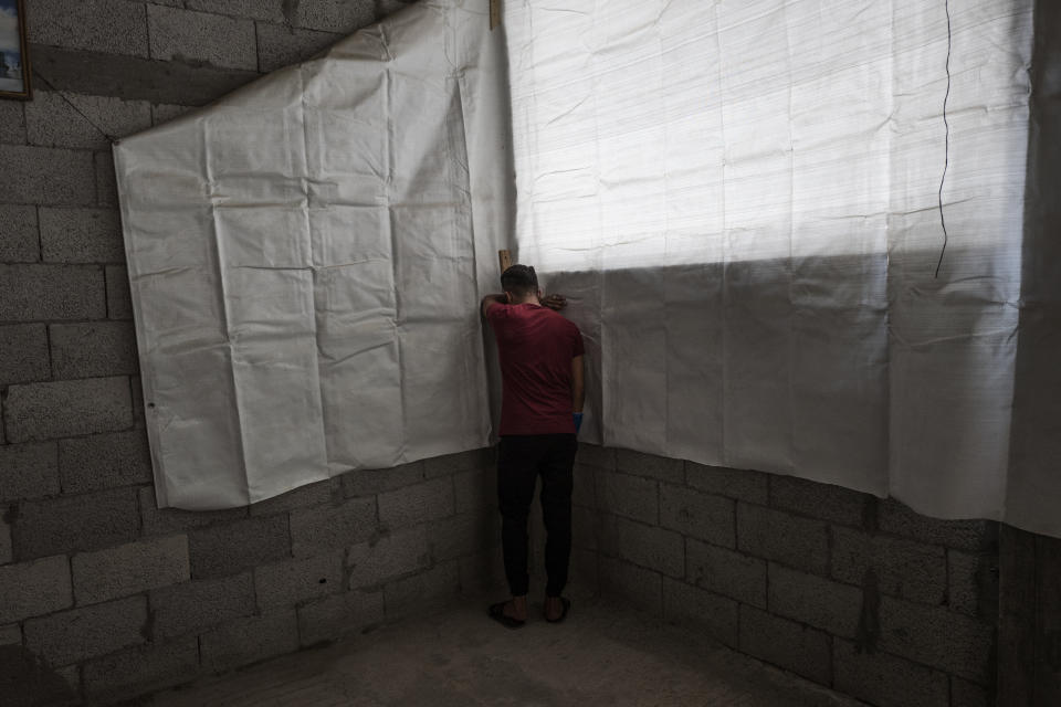 <p>A Palestinian man morns the death of Jamal Afaneh (15) at the family’s home during his funeral in Rafah refugee camp, southern Gaza Strip on May 13, 2018. (Photo: Fabio Bucciarelli for Yahoo News) </p>