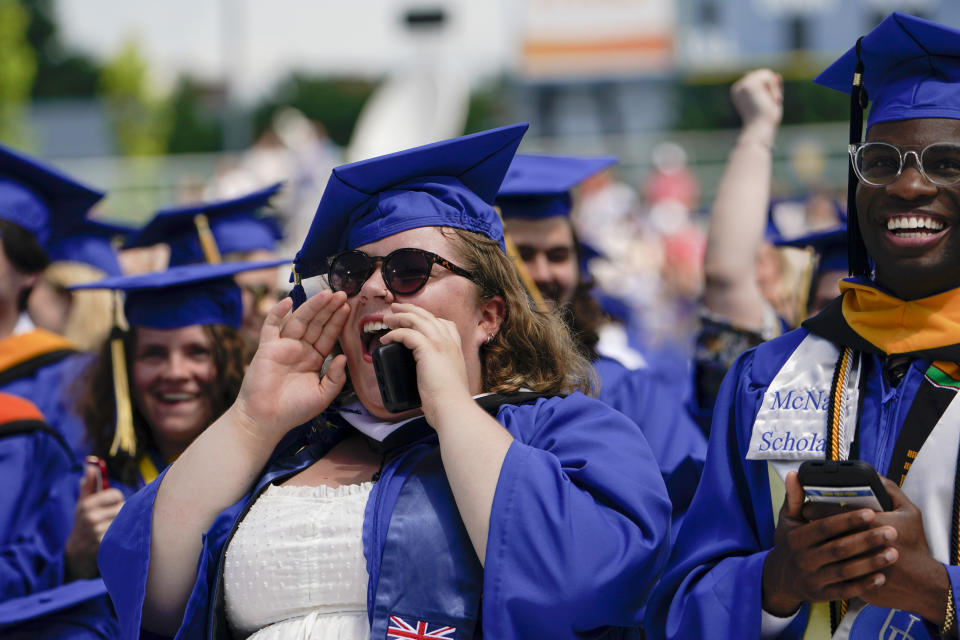 Graduates celebrate during the University of Delaware Class of 2022 commencement ceremony in Newark, Del., Saturday, May 28, 2022. (AP Photo/Manuel Balce Ceneta)
