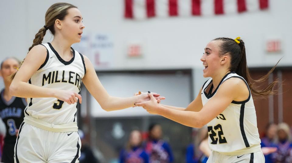 Noblesville Millers guard Ally Hutchinson (3) high-fives Noblesville Millers guard Reagan Wilson (22) after scoring a three-point basket Saturday, Feb. 3, 2024, during the IHSAA girls basketball sectional Class 4A game at Hamilton Southeastern High School in Indianapolis. The Noblesville Millers defeated the Hamilton Southeastern Royals, 49-45.