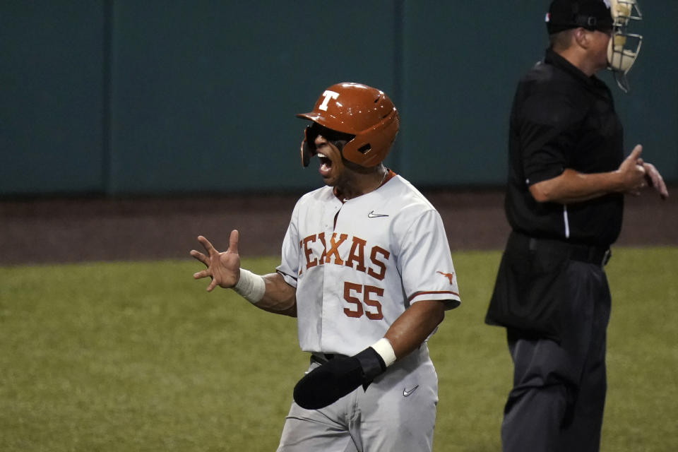 Texas' Camryn Williams (55) reacts after scoring against South Florida during the third inning of an NCAA Super Regional college baseball game, Sunday, June 13, 2021, in Austin, Texas. (AP Photo/Eric Gay)