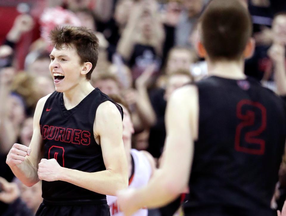 Lourdes Academy's Hayden Jones reacts after making a layup with 1.5 seconds left in the game to put his team up by two against Osseo-Fairchild High School during their WIAA Division 4 boys basketball state semifinal on Thursday, March 14, 2019, at the Kohl Center in Madison. Lourdes defeated Osseo-Fairchild 70-68.