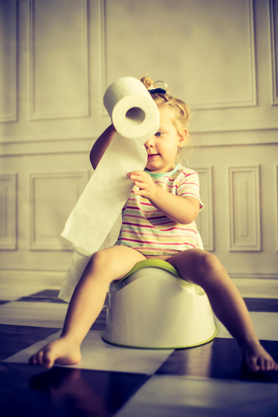 Child sitting on potty. (Shutterstock )