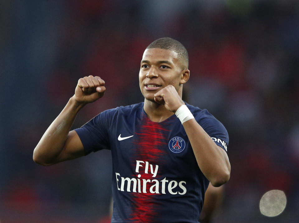PSG's Kylian Mbappe celebrates after scoring his side's fourth goal during the French League One soccer match between Paris-Saint-Germain and Amiens at the Parc des Princes stadium in Paris, France, Saturday, Oct. 20, 2018. (AP Photo/Francois Mori)