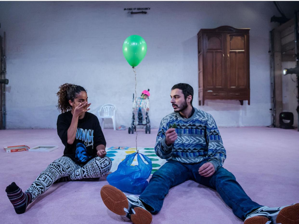 Baby Aya’s mother Nur (Hoda Bentaher), Baby Aya (Jasmine Jones), and Jaden (Noof McEwan) in 'Buggy Baby' at The Yard Theatre (Photo: The Other Richard)