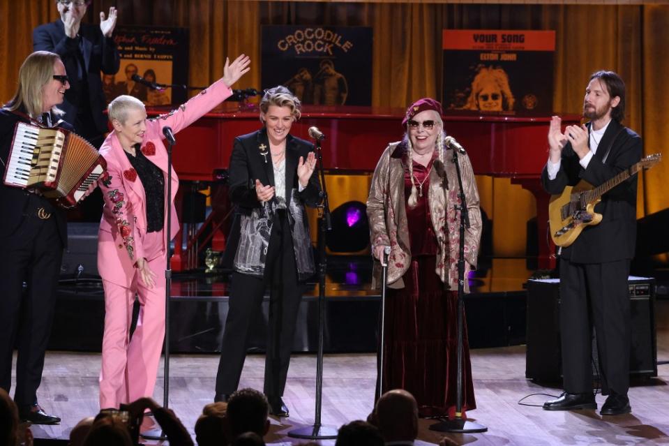 Folk singer Joni Mitchell (second from right) left viewers speechless on Monday when the iconic singer took the stage at the Gershwin Prize ceremony to honor Elton John and Bernie Taupin with a jazzy rendition of their 1983 hit “I’m Still Standing.” Taylor Hill/WireImage