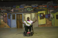 Singer and composer Nelson Sargento, from the Mangueira samba school, 96, poses for a photo after attending a symbolic Carnival opening ceremony at the Samba Museum during the COVID-19 pandemic in Rio de Janeiro, Brazil, Friday, Feb. 12, 2021. Samba school members held a cleansing ceremony at a time that normally would be the start of four days of parades and parties, but this year Carnival will mostly take place online after city officials canceled festivities due to the pandemic. (AP Photo/Silvia Izquierdo)